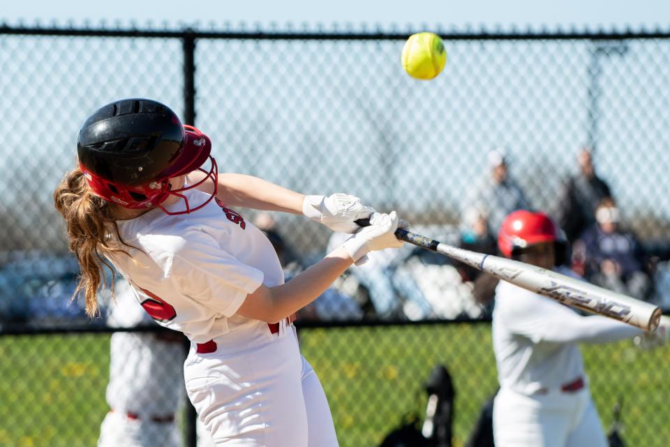 Souderton's Taylor Nelson swings for a hit against Truman during a softball game, Wednesday, April 20, 2022, at Souderton Area High School in Franconia. Big Red defeated the Tigers 7-3.