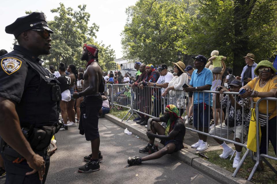 Spectators gather to watch the West Indian Day Parade, Monday, Sept. 4, 2023, in the Brooklyn borough of New York. The largest U.S. celebration of Caribbean culture is held in New York City, as steel bands, floats and flamboyantly costumed revelers take to the streets in the West Indian Day parade. (AP Photo/Yuki Iwamura)