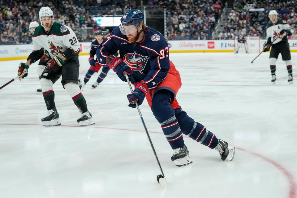 Oct 25, 2022; Columbus, Ohio, USA;  Columbus Blue Jackets right wing Jakub Voracek (93) skates past Arizona Coyotes center Jack McBain (22) during the first period of the NHL hockey game at Nationwide Arena. Mandatory Credit: Adam Cairns-The Columbus Dispatch