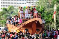 The float of the MMFF 2012 entry "Thy Womb" makes its way through the crowd at the 2012 Metro Manila Film Festival Parade of Stars on 23 December 2012.(Angela Galia/NPPA Images)