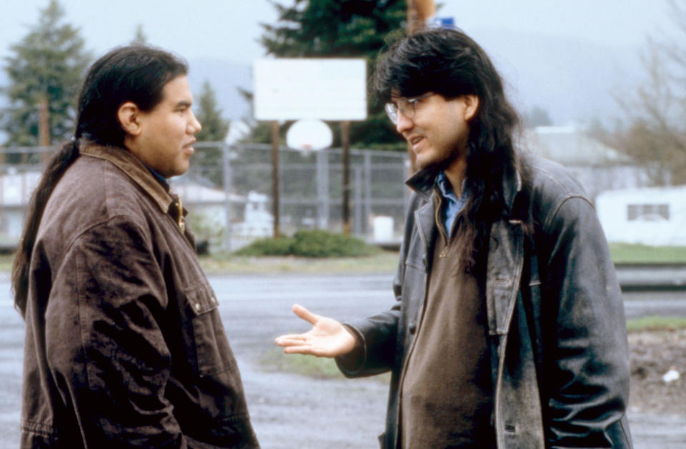 Two young men talking to each other