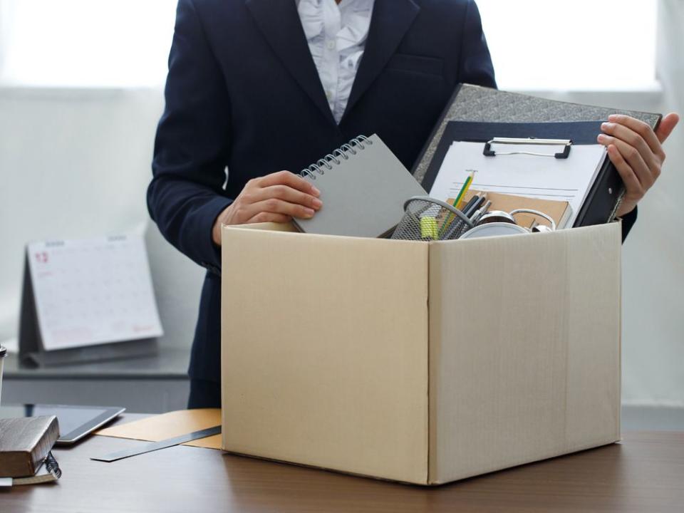 Resignation concept.Businesswoman packing personal company belongings when she deciding resignation change of job or fired from the company.