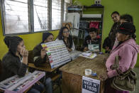 <p>A so called “popular vote”, in which the person who can’t read or write points to her preference on the poster at a polling station during the presidential elections in Santa Ana, Honduras. (Photo: Francesca Volpi) </p>