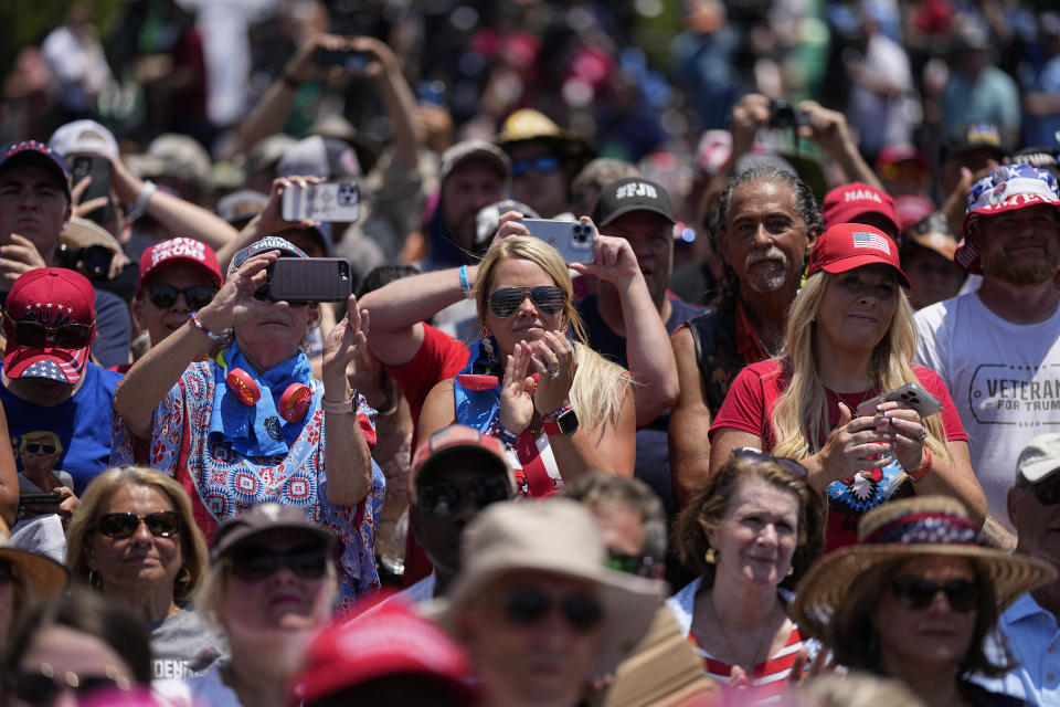 People listen to former President Donald Trump speaking during a rally, Saturday, July 1, 2023, in Pickens, S.C. (AP Photo/Chris Carlson)