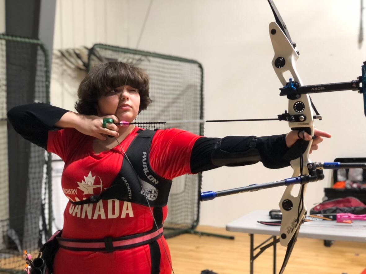 Sophia Elder, 13, has broken 13 national archery records since taking up the sport two-and-a-half years ago. Elder will representing Team NWT as archery makes its Arctic Winter Games debut. (Natalie Pressman/CBC - image credit)