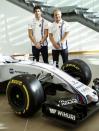 The newly announced Williams Martini Racing driver for the 2017 season Lance Stroll (L) poses for photographers with team-mate Valteri Bottas beside this year's Formula 1 car at their base in Wantage, Britain November 3, 2016. REUTERS/Eddie Keogh