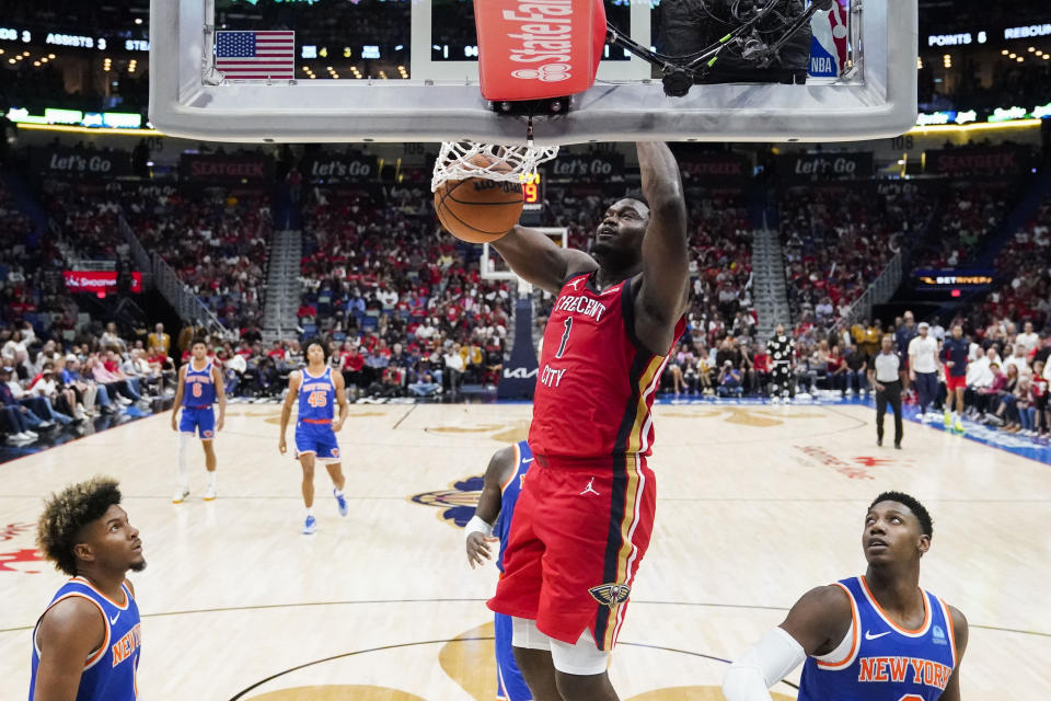 New Orleans Pelicans forward Zion Williamson (1) slam dunks in the second half of an NBA basketball game against the New York Knicks in New Orleans, Saturday, Oct. 28, 2023. The Pelicans won 96-87. (AP Photo/Gerald Herbert)