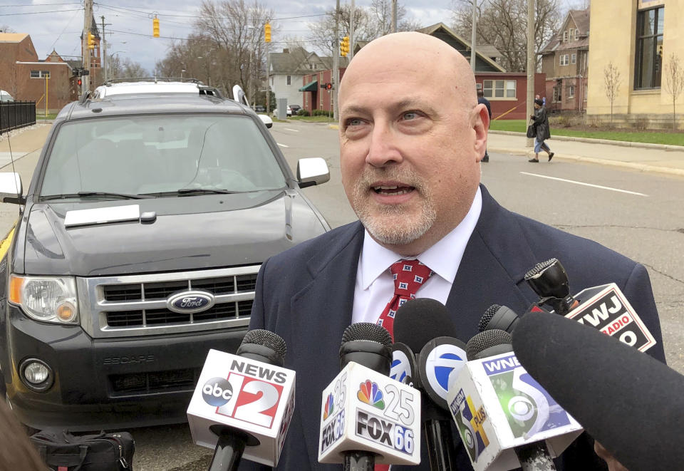 Retired Bishop Airport police Lt. Jeff Neville speaks to reporters outside the federal courthouse in Flint, Mich., Thursday, April 18, 2019. Amor Ftouhi, of Canada, convicted of terrorism for nearly killing Neville in June 2017, was sentenced Thursday to life in prison after defiantly declaring he had no regrets and only wished he had carried a machine gun that day instead of a knife. (AP Photo/Ed White)