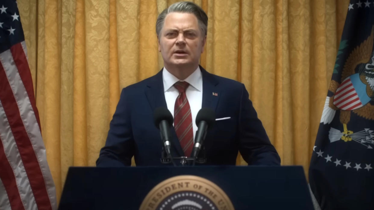  Nick Offerman speaking from the White House podium in Civil War. 