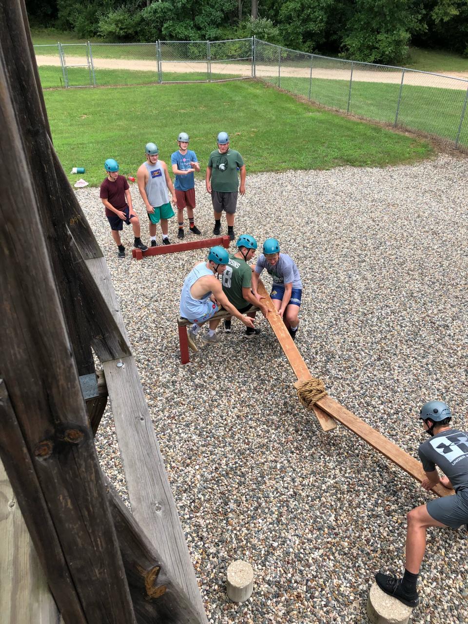 The Hornets work together through teamwork exercises on the LRC course.