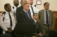 Former NFL player Aaron Hernandez and his defense team listen as the guilty verdict is read during his murder trial at the Bristol County Superior Court in Fall River, Massachusetts, April 15, 2015. Hernandez, 25, a former tight end for the New England Patriots, is convicted of fatally shooting semiprofessional football player Odin Lloyd in an industrial park near Hernandez's Massachusetts home in June 2013. REUTERS/Dominick Reuter