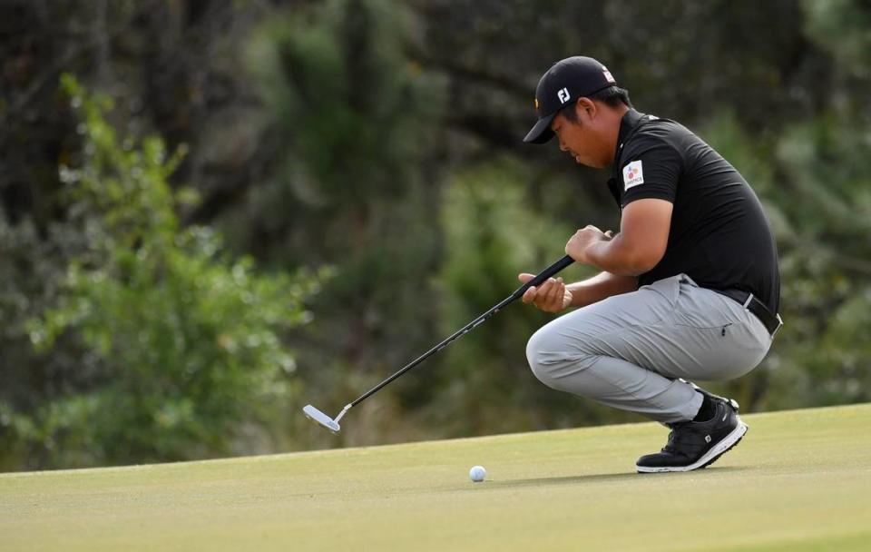 Byeong Hun An of Seoul, Korea, studies his putt on the green of the par 4, 491-yard, second hole on Friday, Feb. 18, 2022 during the second round of the LECOM Suncoast Classic on the Korn Ferry Tour at Lakewood National Golf Club. Mike Lang/USA TODAY NETWORK