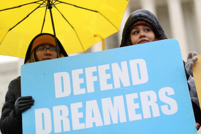 FILE PHOTO: People gather outside the U.S. Supreme Court during oral arguments in Trump administration’s bid to end the DACA program in Washington