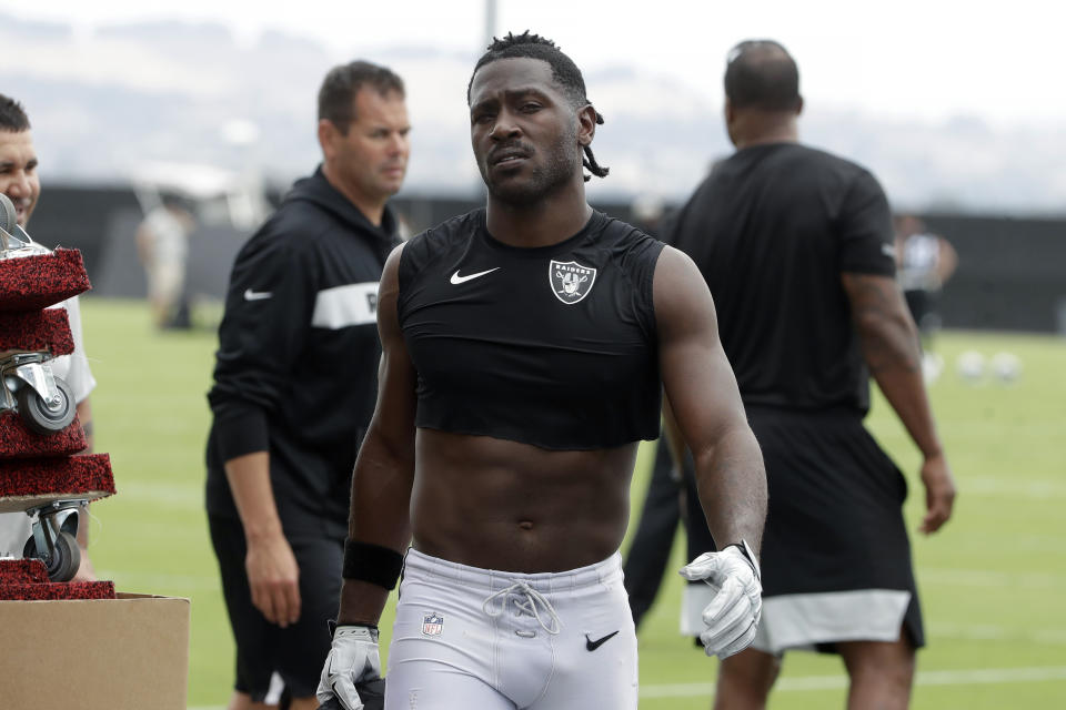 FILE - In this Aug. 20, 2019, file photo, Oakland Raiders' Antonio Brown walks off the field after NFL football practice in Alameda, Calif. Star receiver Antonio Brown is not with the Oakland Raiders four days before the season opener amid reports he could be suspended over a confrontation with general manager Mike Mayock. Mayock issued a brief statement at the beginning of practice Thursday, Sept. 5, 2019, saying that Brown wasn't at the Raiders facility and won't be practicing a day after Brown posted a letter from the GM on social media detailing nearly $54,000 in fines. (AP Photo/Jeff Chiu, File)