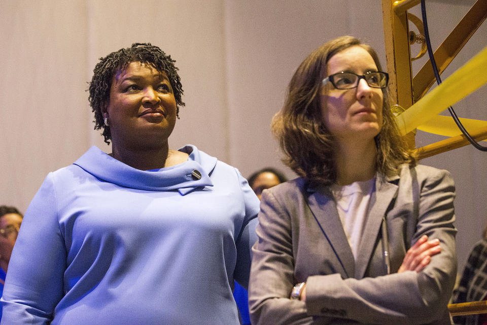 Georgia gubernatorial candidate Stacey Abrams, left, stands with her campaign manager, Lauren Groh-Wargo, before speaking to her supporters during an election night watch party at the Hyatt Regency in Atlanta, Wednesday, Nov. 7, 2018. Georgia's hotly contested and potentially historic governor's race may not be over yet, with Democrat Abrams and Republican Brian Kemp awaiting the final accounting of absentee and provisional ballots. (Alyssa Pointer/Atlanta Journal-Constitution via AP)