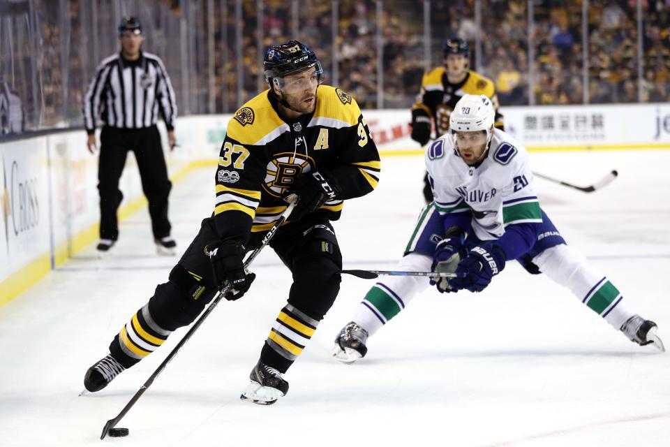 <p>BOSTON, MA - OCTOBER 19: Patrice Bergeron #37 of the Boston Bruins skates against Brandon Sutter #20 of the Vancouver Canucks during the first period at TD Garden on October 19, 2017 in Boston, Massachusetts. (Photo by Maddie Meyer/Getty Images)</p>