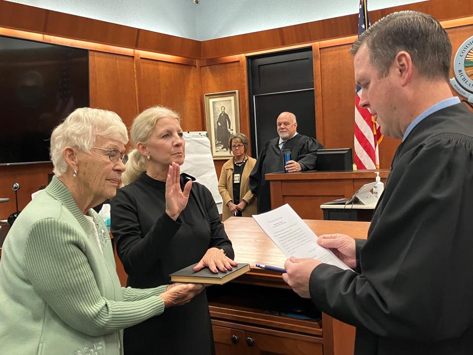 Denise Jackson is sworn in Monday morning as the new Richland County recorder. Common Pleas Judge Brent Robinson swore her in, as her mother, Marcia Goldsmith, looked on.