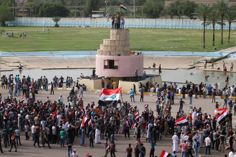 Iraqi protesters gather in the parade grounds outside the parliament in Baghdad's heavily fortified "Green Zone" on May 1, 2016,