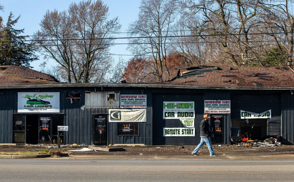 The area of a strip mall in the 500 block of North Dirksen Parkway that was formerly occupied by Luech Kustoms shows heavy damage Wednesday from a fire overnight. The building also included Green Garden Tobacco and Salon 1782 as tenants. [Justin L. Fowler/The State Journal-Register]