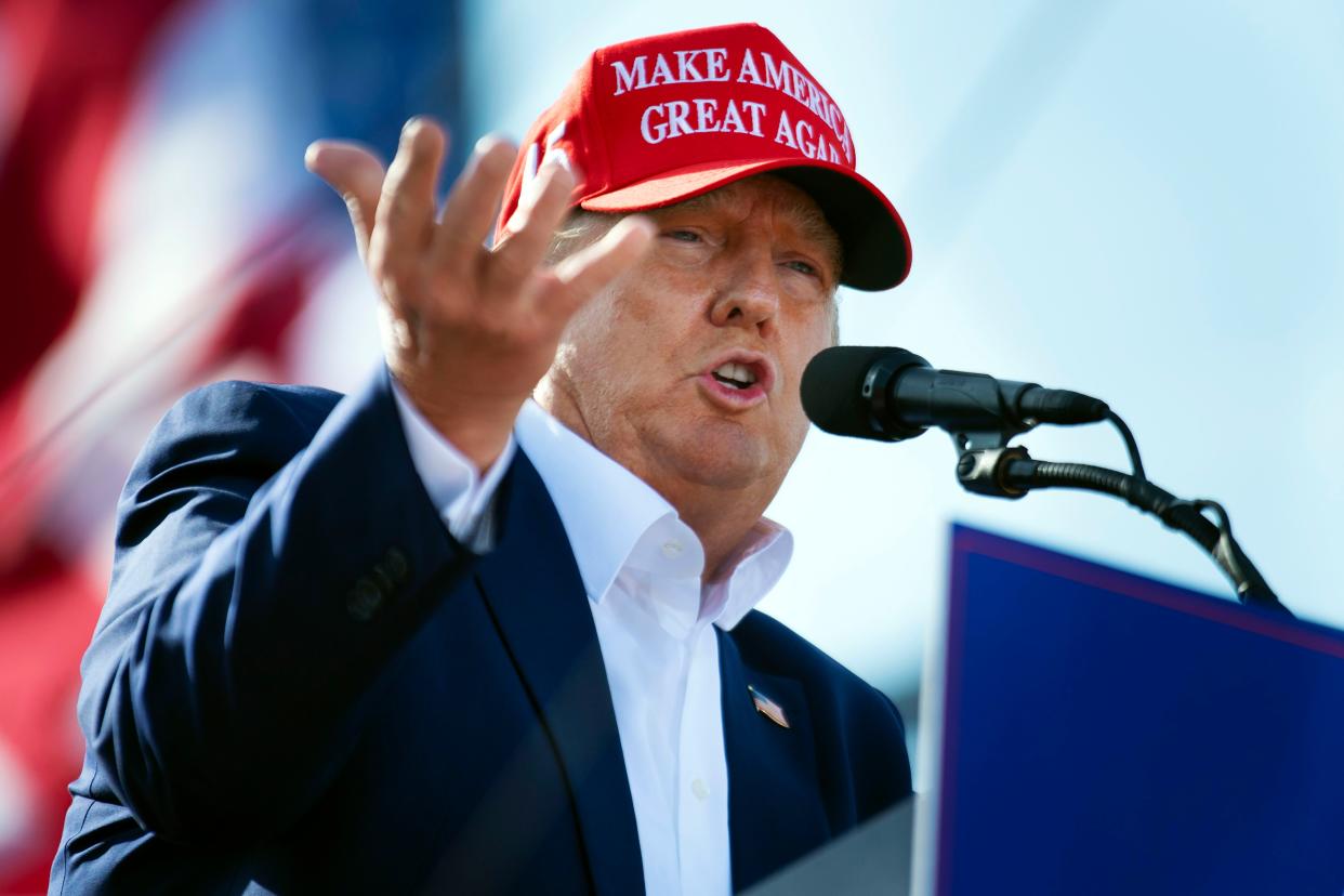 Former President Donald Trump speaks from the podium during a campaign rally, on May 1, 2022, in Greenwood, Neb. 