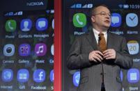 Nokia Chief Executive Stephen Elop speaks with the media after unveiling a new $99 phone in its mid-range Asha line at a launch in New Delhi in this May 9, 2013 file photo. REUTERS/Anindito Mukherjee/Files