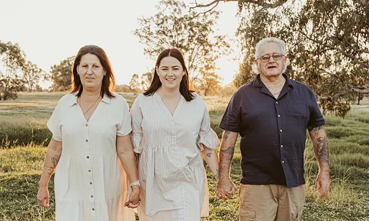 <span>Molly Ticehurst (centre) with her parents Kate and Tony. NSW police are investigating the alleged theft of items from her home</span><span>Photograph: supplied by the Ticehurst family</span>