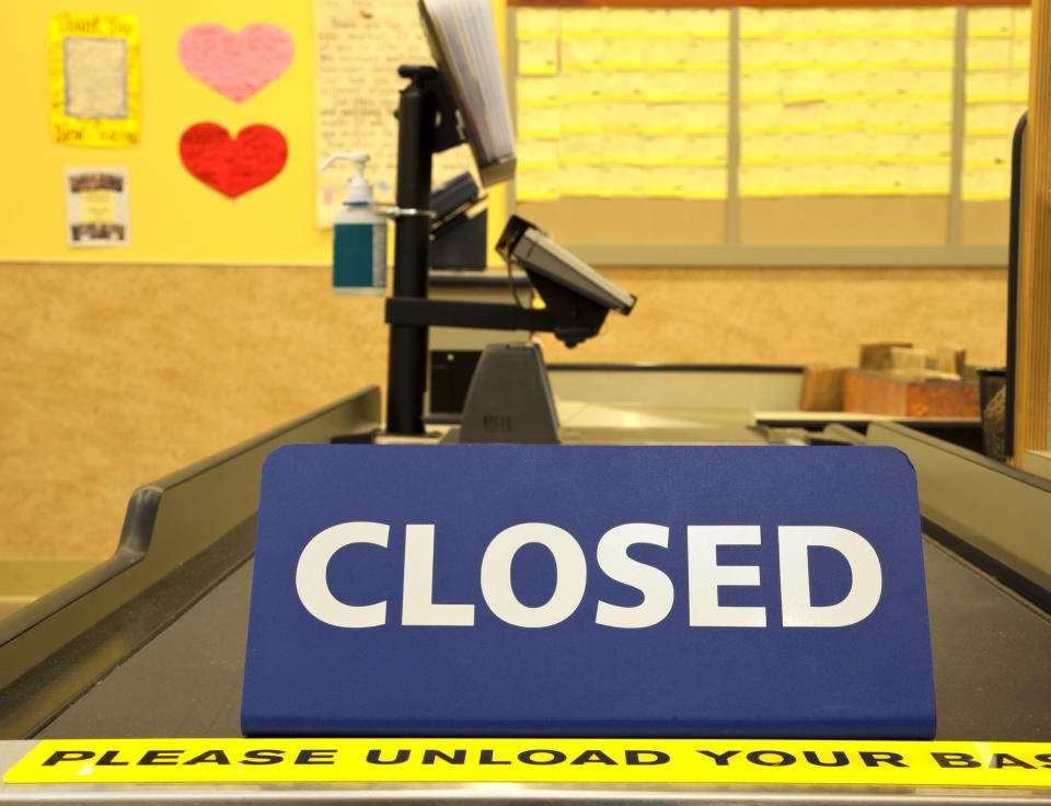 A "Closed" sign at checkout