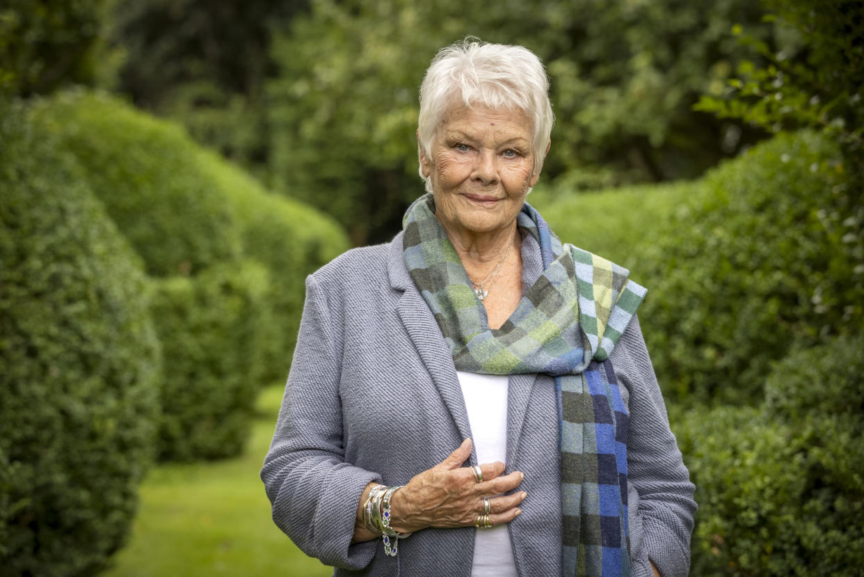 Dame Judi Dench pictured in the garden of her Surrey home.