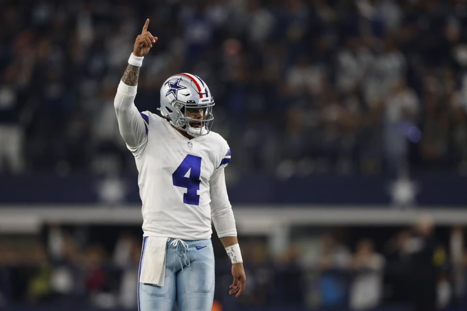Dallas Cowboys' Dak Prescott celebrates a touchdown during the second half of an NFL football game against the Indianapolis Colts, Sunday, Dec. 4, 2022, in Arlington, Texas. (AP Photo/Ron Jenkins)