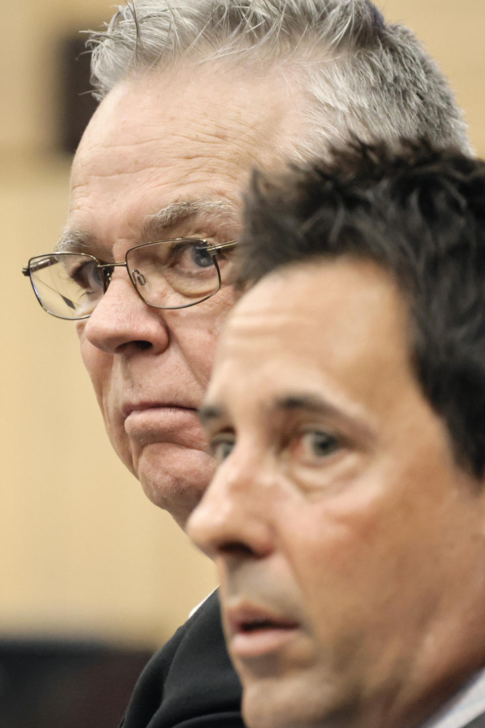 Former Marjory Stoneman Douglas High School School Resource Officer Scot Peterson, left, sits with his defense lawyer Mark Eiglarsh before the start of a hearing at the Broward County Courthouse in Fort Lauderdale, Fla., on Tuesday, May 30, 2023. Peterson is about to be tried on charges he failed to confront the gunman who murdered 14 students and three staff members at a Parkland high school five years ago. (Amy Beth Bennett/South Florida Sun-Sentinel via AP, Pool)