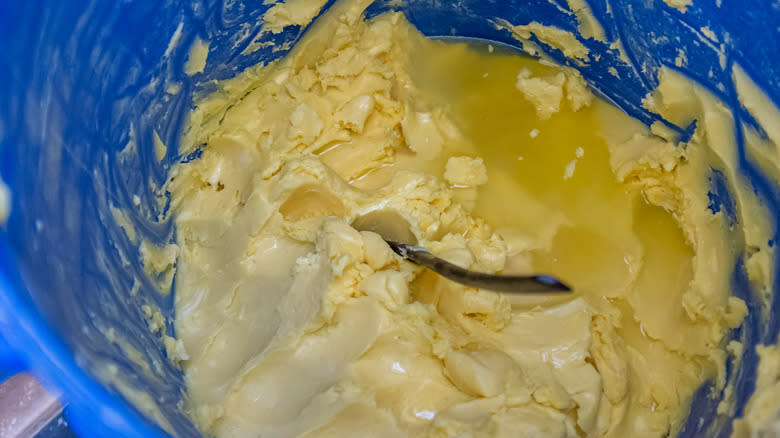 Butter being prepared in pail