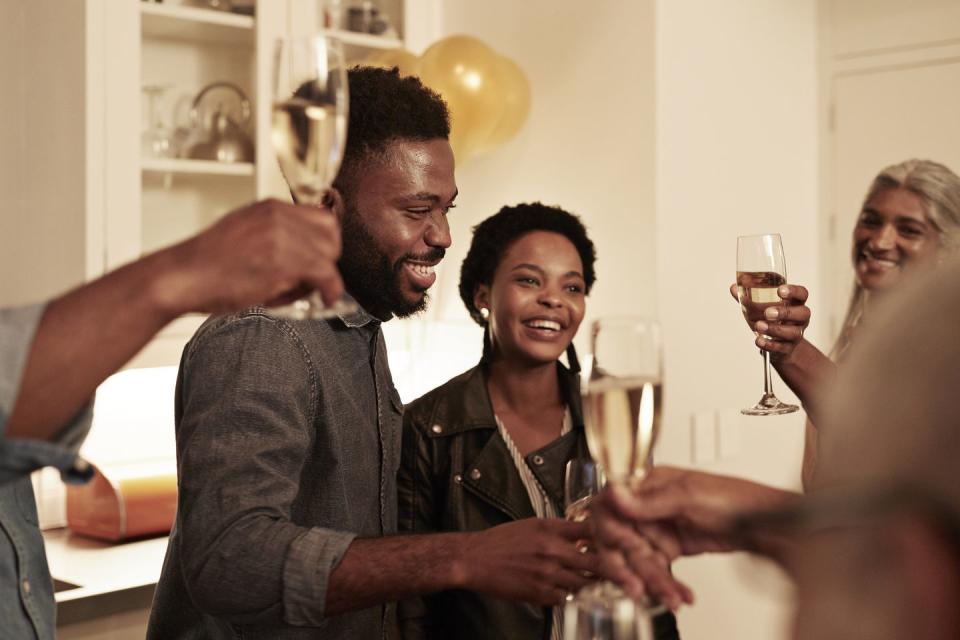 smiling family enjoying drinks at birthday party