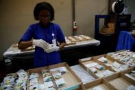 A worker from the Casa da Moeda do Brasil (Brazilian Mint) prepares Rio 2016 Olympic medals in Rio de Janeiro, Brazil, June 28, 2016. REUTERS/Sergio Moraes