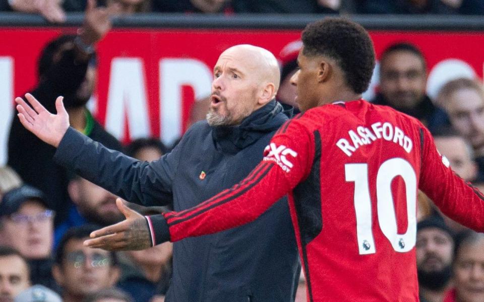 Manchester United's manager Erik ten Hag (L) and player Marcus Rashford reacts during the English Premier League soccer match between Manchester United and Luton Town FC