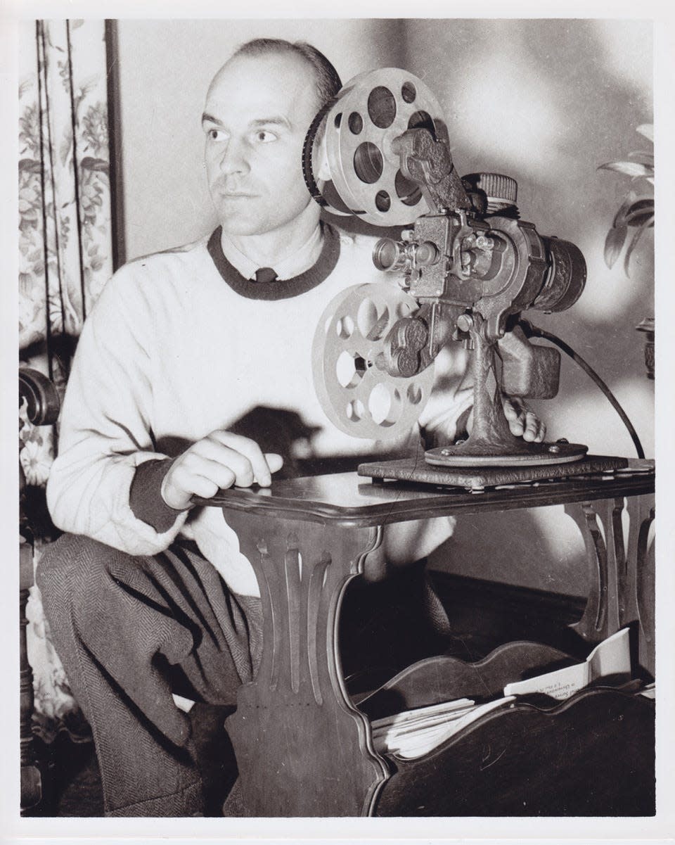 Paul Brown reviewing film, c. 1938. Reproduction of original gelatin silver print. Gift of the Massillon Tiger Football Booster Club. Collection of the Massillon Museum.