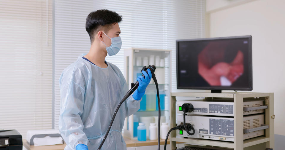 Diagnosis of abdominal or gastrointestinal cancers may include blood tests, imaging or CT scans, and an endoscope.  (Getty Images) An Asian doctor wearing a protective gown performs a colonoscopy for an elderly man and discovers a cytopathic effect or tumor.