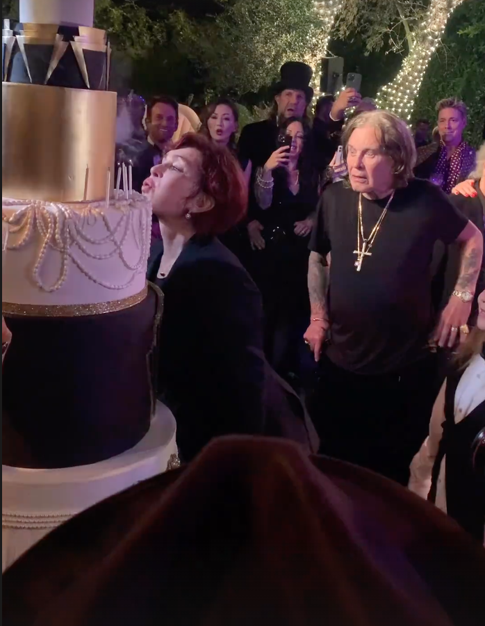 Sharon Osbourne blows out the candles on her birthday cake. (Instagram/Sharon Osbourne)