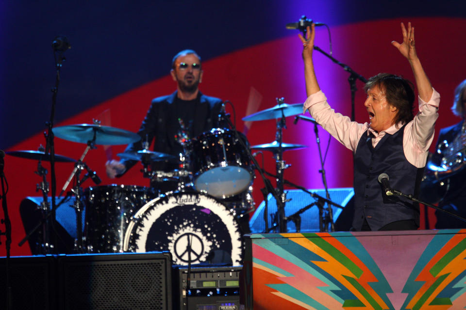 Paul McCartney and Ringo Starr perform at The Night that Changed America: A Grammy Salute to the Beatles, on Monday, Jan. 27, 2014, in Los Angeles. (Photo by Zach Cordner/Invision/AP)