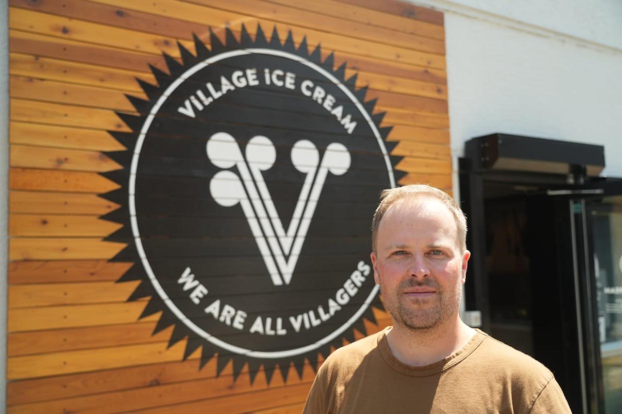 Village Ice Cream co-founder Billy Friley says hot weather is good for business. On days when the temperature spikes, he says, the company serves thousands of customers at its locations across Calgary.  (Ose Irete/CBC - image credit)