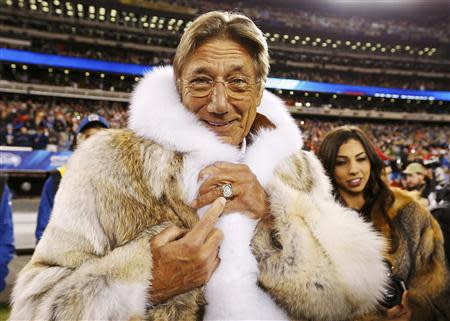 Former New York Jets quarterback Joe Namath points to his championship ring before the Seattle Seahawks play the Denver Broncos in the NFL Super Bowl XLVIII football game in East Rutherford, New Jersey, February 2, 2014. REUTERS/Carlo Allegri