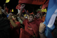 Supporters of Free Party presidential candidate Xiomara Castro cheer before she speaks after general elections, in Tegucigalpa, Honduras, Sunday, Nov. 28, 2021. Castro claimed victory, setting up a showdown with the National Party which said its candidate had won a vote that could end the conservative party's 12 years in power. (AP Photo/Moises Castillo)