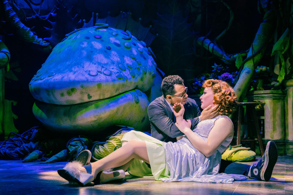 Corbin Bleu as Seymour & Jinkx Monsoon as Audrey lay on the ground caressing each other in Little Shop of Horrors (Courtesy Evan Zimmerman)