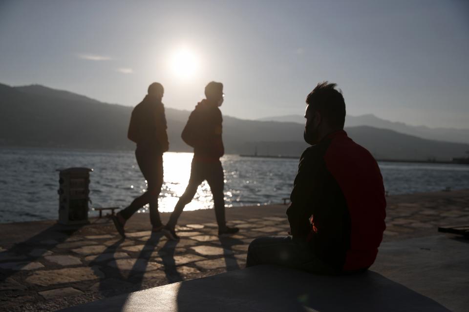 An Afghan father sits on a bench at the port of Vathy on the eastern Aegean island of Samos, Greece, Monday, Feb. 22, 2021. On a hill above a small island village, the sparkling blue of the Aegean just visible through the pine trees, lies a boy’s grave. His first ever boat ride was to be his last - the sea claimed him before his sixth birthday. His 25-year-old father, like so many before him, had hoped for a better life in Europe, far from the violence of his native Afghanistan. But his dreams were dashed on the rocks of Samos, a picturesque Greek island almost touching the Turkish coast. Still devastated from losing his only child, the father has now found himself charged with a felony count of child endangerment. (AP Photo/Thanassis Stavrakis)