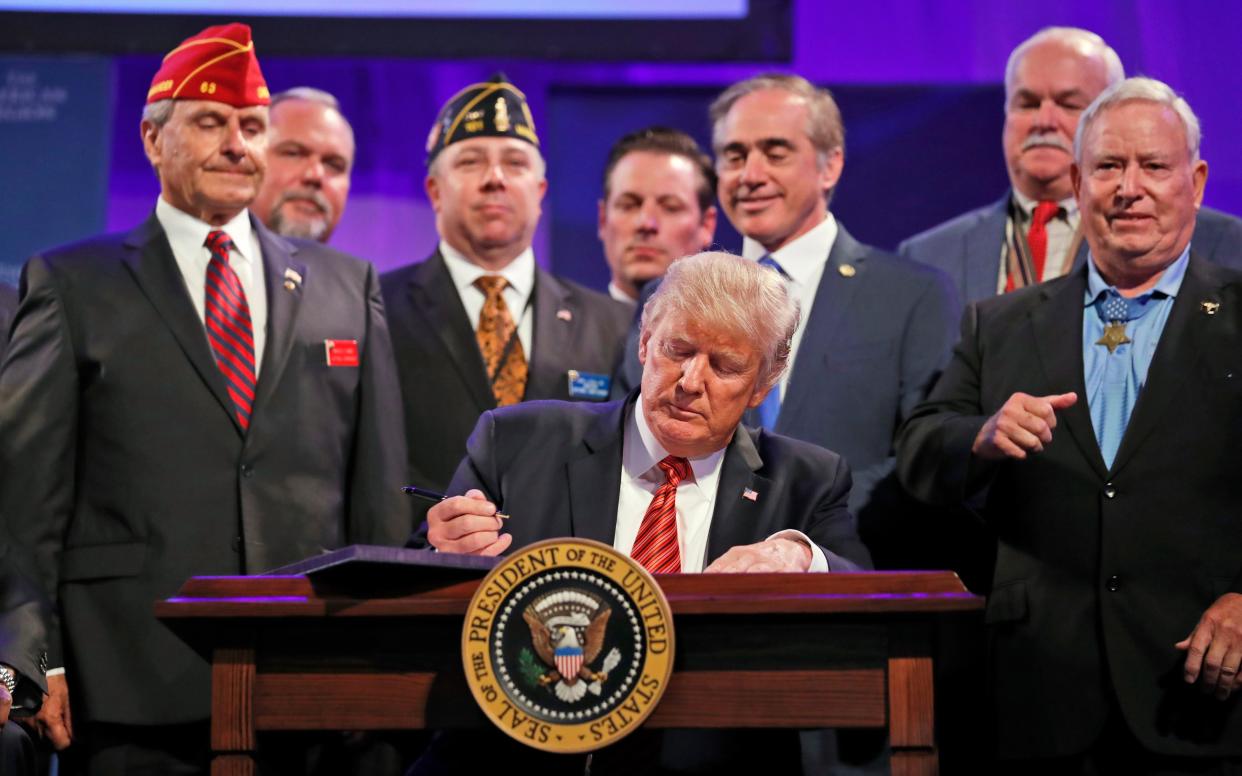 Donald Trump with veterans at an event in Reno, Nevada - Copyright 2017 The Associated Press. All rights reserved.