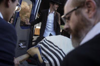 Mourners carry the body of 16-year-old Aryeh Shechopek, a dual Israeli-Canadian citizen, during his funeral in Jerusalem, Wednesday, Nov. 23, 2022. Two blasts have gone off near bus stops in Jerusalem, killing Shechopek and injuring at least 18, in what Israeli police said were suspected attacks by Palestinians. (AP Photo/Maya Alleruzzo)