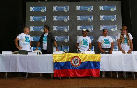 Revolutionary Armed Forces of Colombia (FARC) commander Ivan Marquez arrives with Carlos Lozada, Joaquin Gomez, Mauricio Jaramillo and Pastor Alape before a news conference at the camp where they prepare to ratify a peace deal with the Colombian government, near El Diamante in Yari Plains, Colombia, September 23, 2016. REUTERS/John Vizcaino