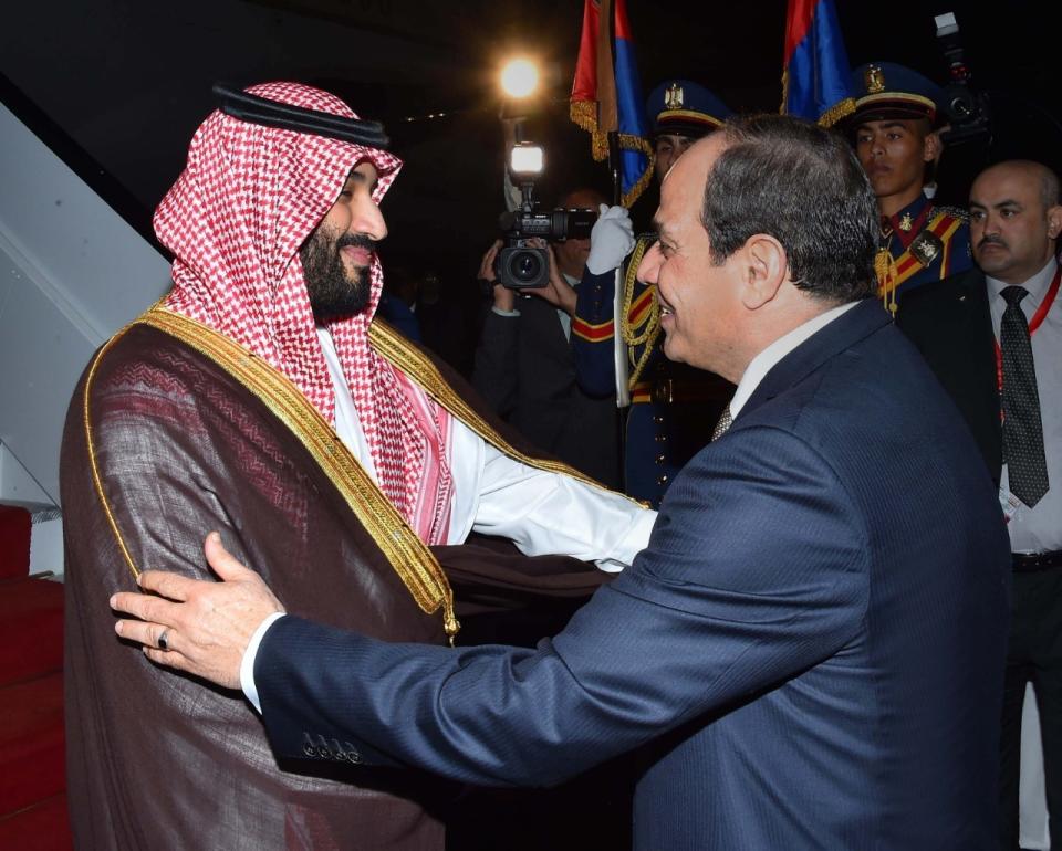 In this Monday, Nov. 26, 2018, photo released by the Egyptian Presidency's office, Saudi Arabia's Crown Prince Mohammed bin Salman is received by Egyptian President Abdel-Fattah El-Sissi in Cairo. (Egyptian Presidency via AP)