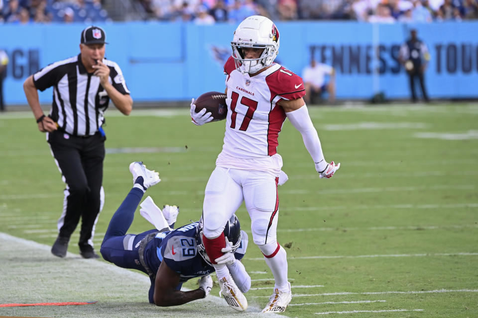 Arizona Cardinals wide receiver Andy Isabella (17) does out of bounds a he is chased by Tennessee Titans safety Theo Jackson (29) in the first half of a preseason NFL football game Saturday, Aug. 27, 2022, in Nashville, Tenn. (AP Photo/Mark Zaleski)