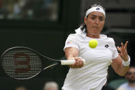Tunisia's Ons Jabeur returns the ball to France's Diane Parry in a third round women's singles match on day five of the Wimbledon tennis championships in London, Friday, July 1, 2022. (AP Photo/Alberto Pezzali)