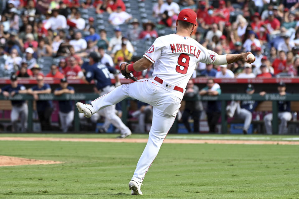 Los Angeles Angels third baseman Jack Mayfield throws to first base on an infield hit by Seattle Mariners' Kyle Seager during the eighth inning of a baseball game, Sunday, Sept. 26, 2021, in Anaheim, Calif. (AP Photo/Michael Owen Baker)